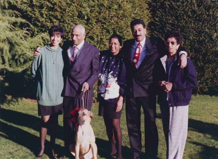 [Group Photo of Phangan Singh Gill with his three children, Vicky, Charan, and Hardave their mom Banto Gill, and Duke]