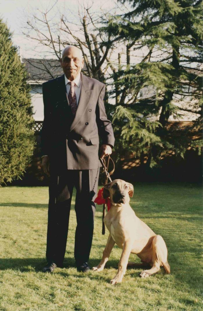 [Photo of Phangan Singh Gill with his 1993 Christmas present, a Great Dane aptly named Duke]