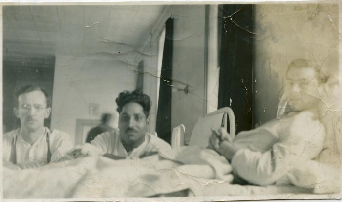 [Photo of Phangan Singh Gill with two unidentified Canadian soldiers in a hospital ward in Halifax, Nova Scotia]
