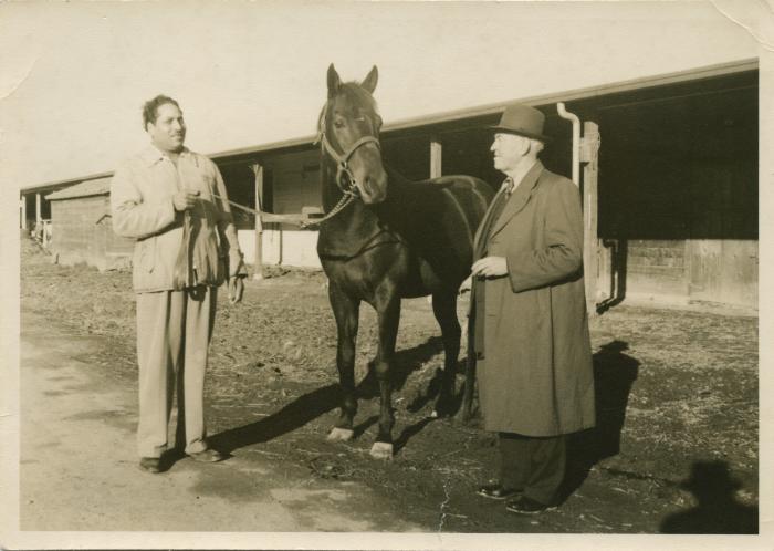 [Photo of Phangan Singh Gill with George Norgan] 