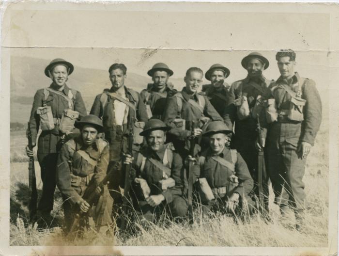 [Photo of Phangan Singh Gill in his Canadian Army uniform with members of his unit]