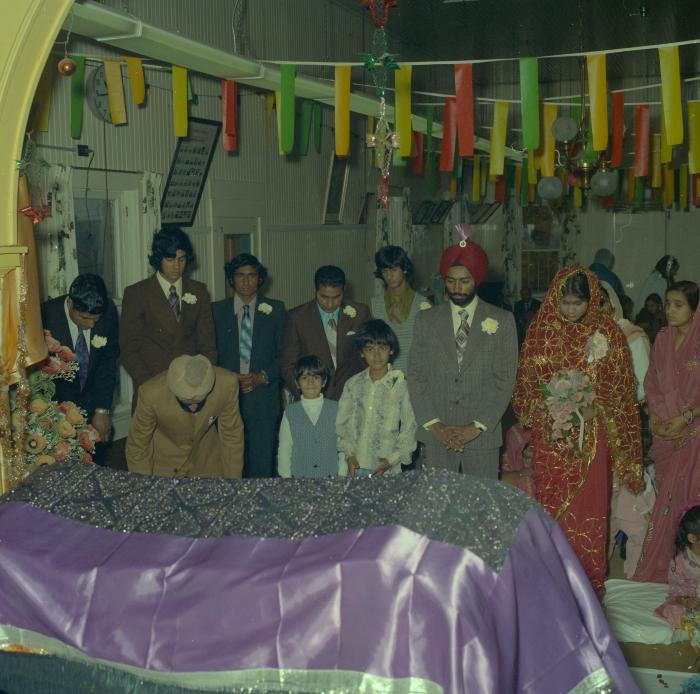 [Photo of Gurdev S. Brar, and unidentified bride and wedding guests]