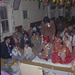 [Photo of Malkit S. Sidhu, Pam Gill and their wedding guests]