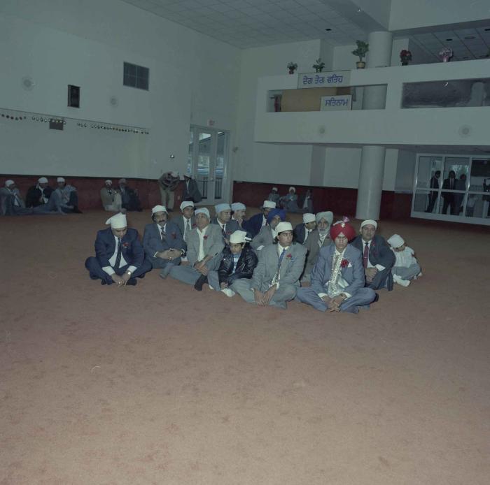 [Photo of Manpreet Brar and a group of unidentified men]