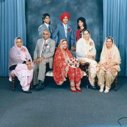 [Photo of Kerneil Sidhu, Gurdev Sidhu and their wedding guests]