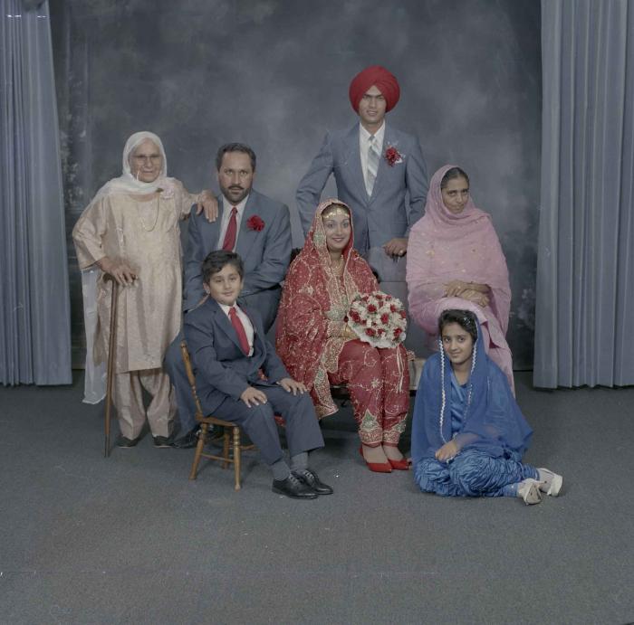 [Group portrait of Jaz Brar, Manpreet Brar and a group of unidentified family members]