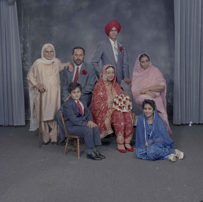 [Group portrait of Jaz Brar, Manpreet Brar and a group of unidentified family members]
