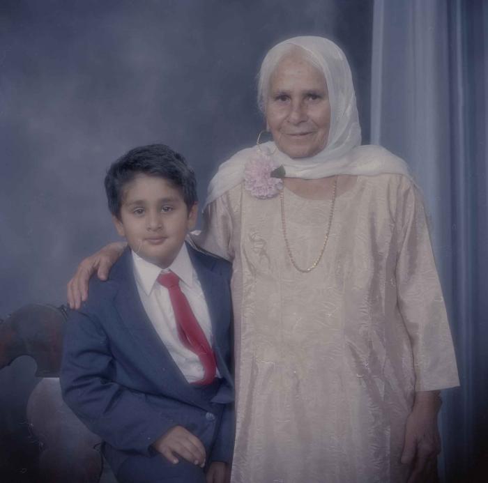 [Group portrait of an unidentifed elderly woman and an unidentified child]
