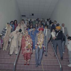 [Photo of Kerneil Sidhu, Gurdev Sidhu and their wedding guests]