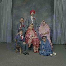 [Group photo of Kerneil Sidhu, Gurdev Sidhu and their wedding guests]