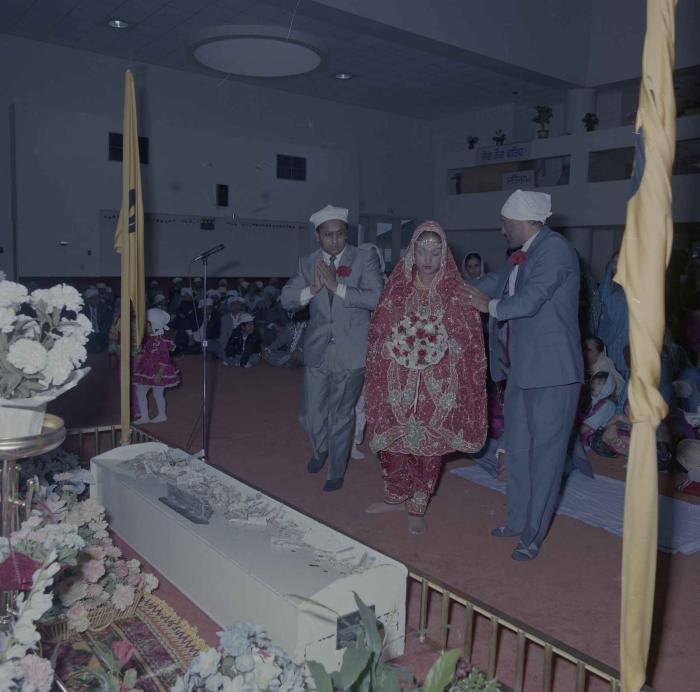 [Photo of Jaz Brar and two unidentified men]