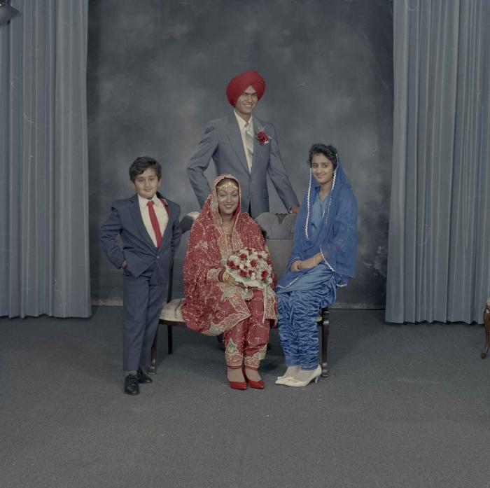 [Group portrait of Jaz Brar, Manpreet Brar and two unidentified children]