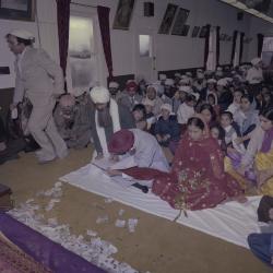 [Photo of Inderjeet Guran, Basant Brar and wedding guests]
