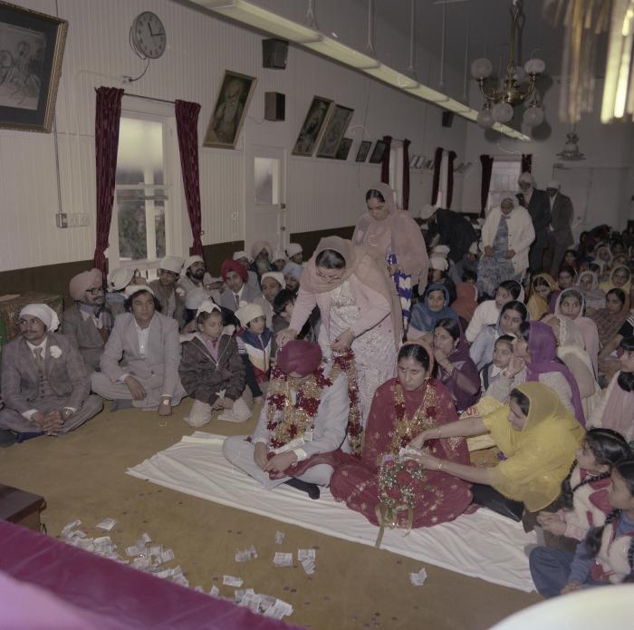 [Photo of Inderjeet Guran, Basant Brar and wedding guests]