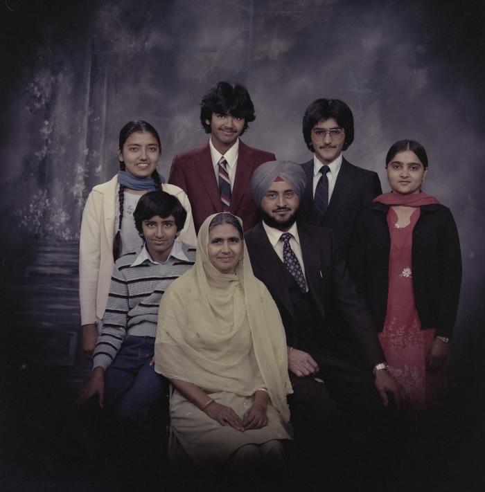 [Group portrait of Harcharan Brar, three unidentified women and three unidentified men]