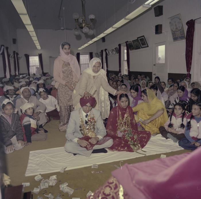 [Photo of Inderjeet Guran, Basant Brar and wedding guests]