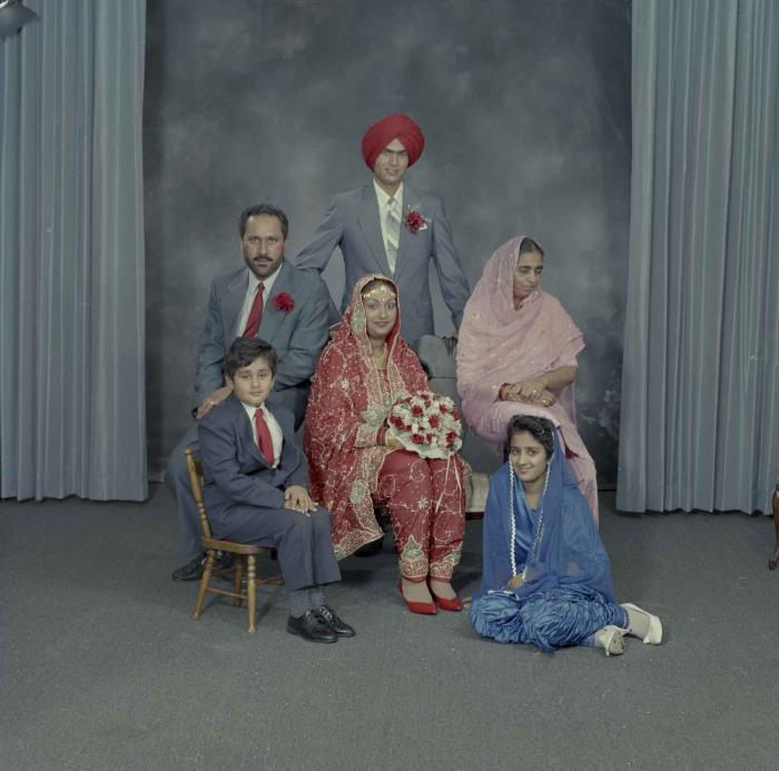 [Group portrait of Jaz Brar, Manpreet Brar and a group of unidentified family members]