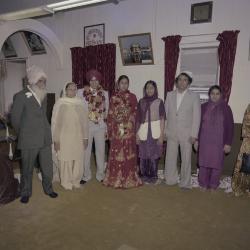 [Group photo of Inderjeet Guran, Basant Brar and a group of unidentified wedding guests]