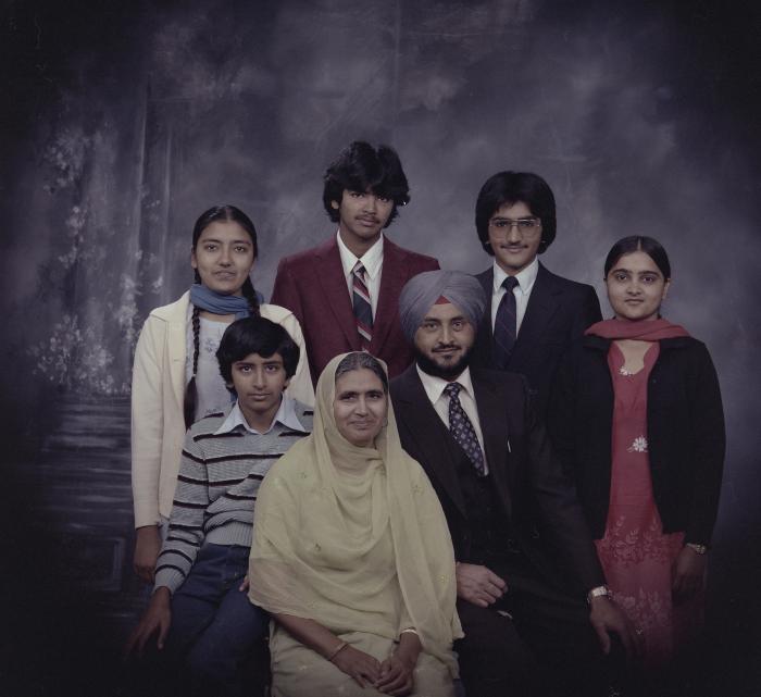 [Group portrait of Harcharan Brar, three unidentified women and three unidentified men]
