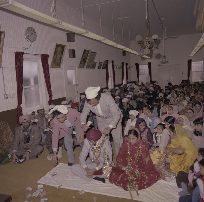 [Photo of Inderjeet Guran, Basant Brar and wedding guests]