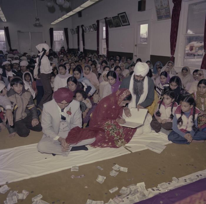 [Photo of Inderjeet Guran, Basant Brar and wedding guests]