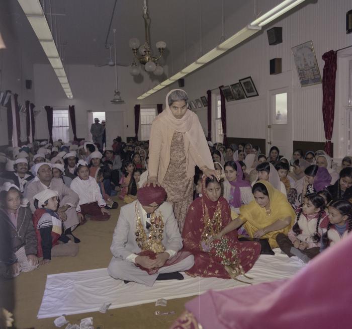 [Photo of Inderjeet Guran, Basant Brar and wedding guests]