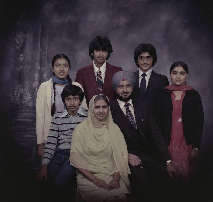 [Group portrait of Harcharan Brar, three unidentified women and three unidentified men]