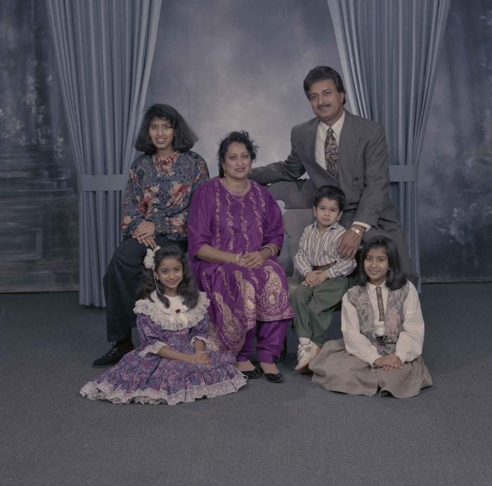 [Group portrait of Onkar and Malkit Brar, along with their children]