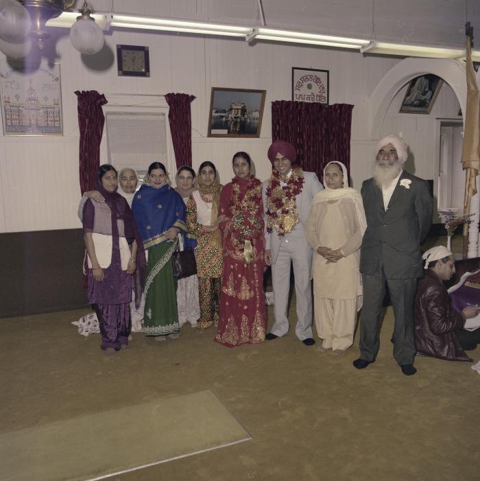 [Group photo of Inderjeet Guran, Basant Brar and wedding guests]