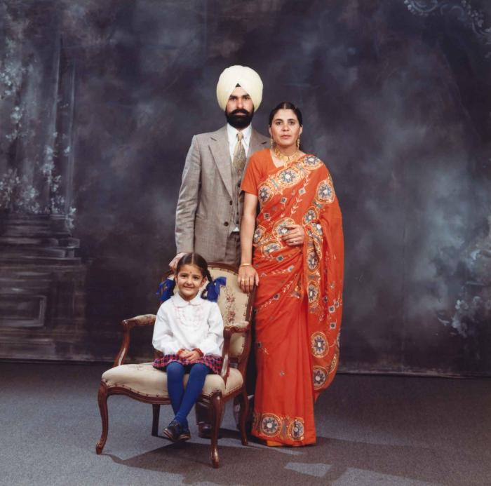 [Group portrait of Harpal Dhaliwal, an unidentified woman and an unidentified child]