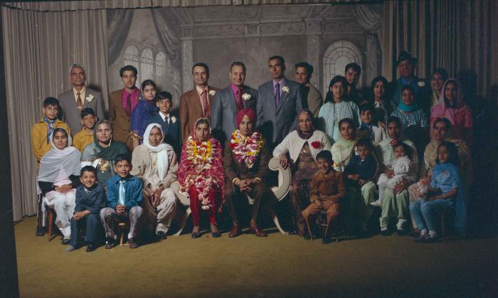 [Group portrait of H.S. Dhaliwal, an unidentified bride and wedding guests]