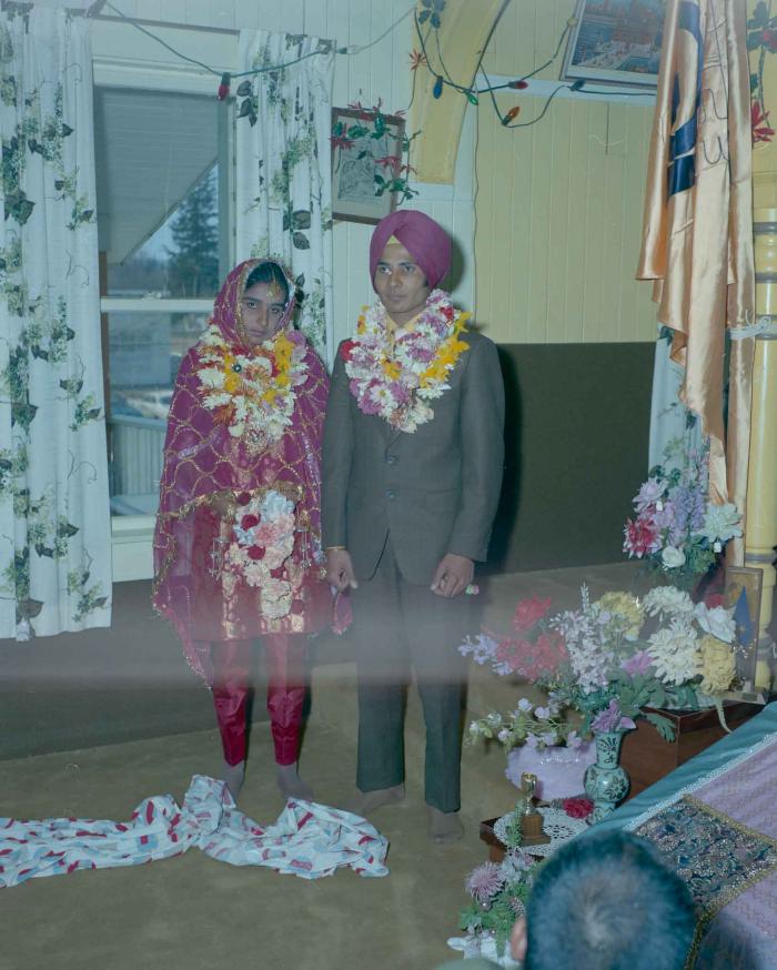 [Group photo of H.S. Dhaliwal and an unidentified bride]