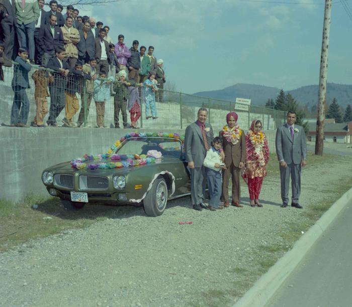 [Photo of H.S. Dhaliwal, an unidentified bride and wedding guests]