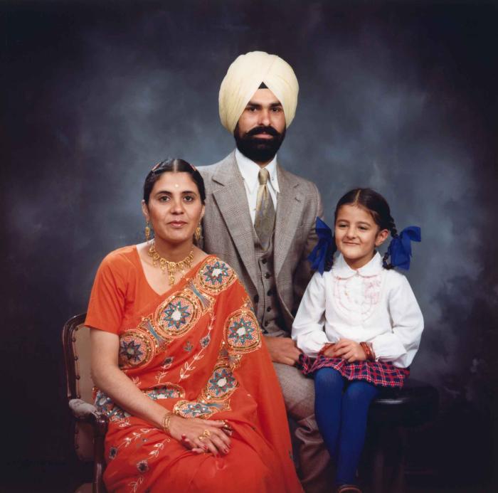 [Group portrait of Harpal Dhaliwal, an unidentified woman and an unidentified child]