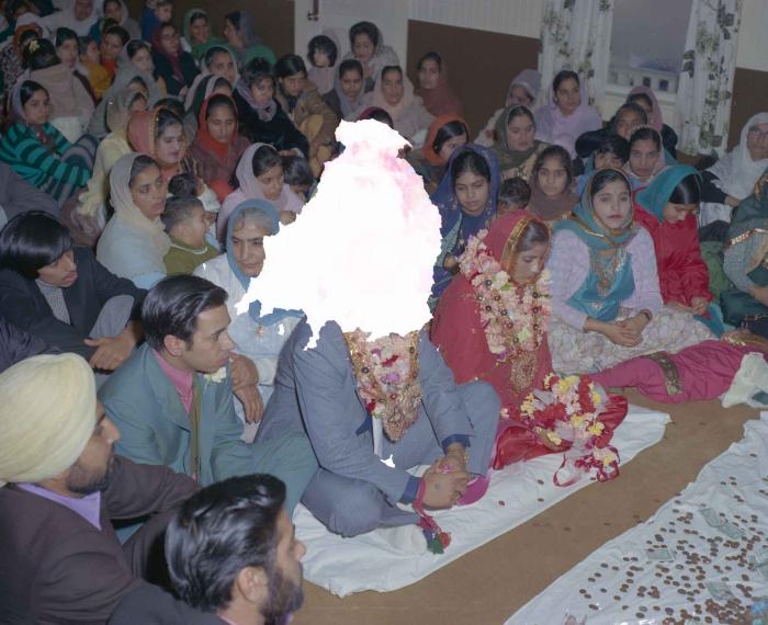 [Photo of Daljit Dhaliwal, an unidentified bride and wedding guests]