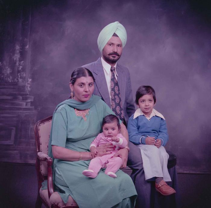 [Group portrait of Darshan Dhaliwal, an unidentified woman and two unidentified children]