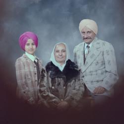 [Group portrait of Jasbir Sidhu, an unidentified woman and two unidentified children]