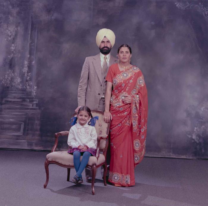 [Group portrait of Harpal Dhaliwal, an unidentified woman and an unidentified child]