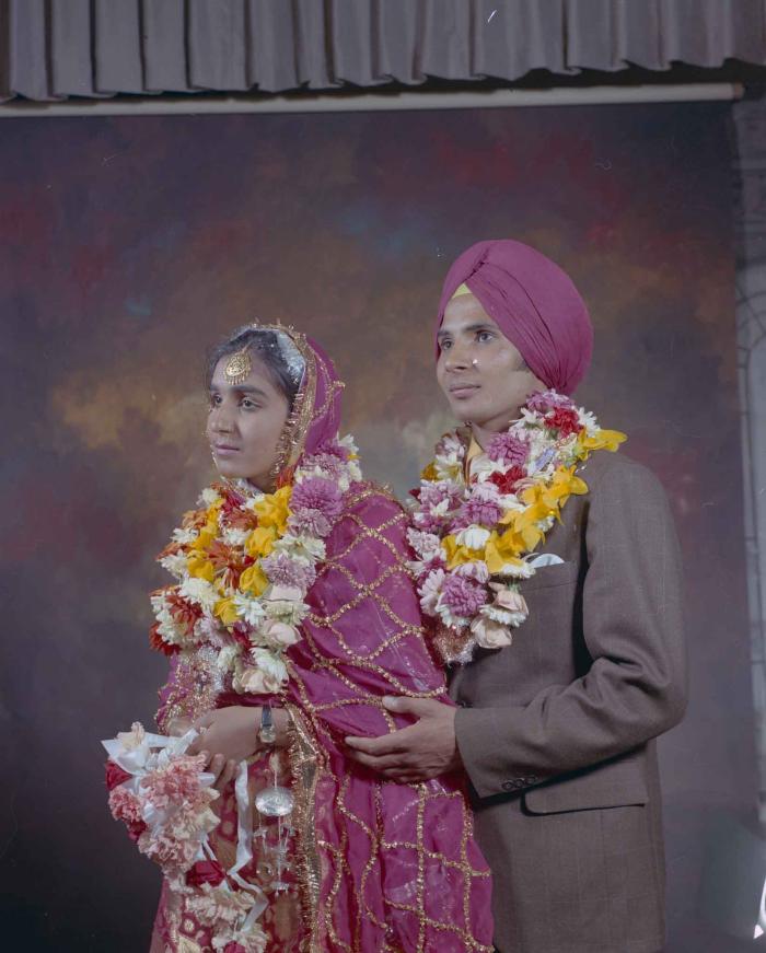 [Group portrait of H.S. Dhaliwal and an unidentified bride]