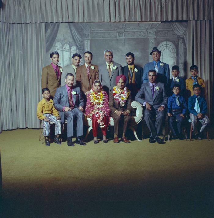 [Group portrait of H.S. Dhaliwal, an unidentified bride and wedding guests]