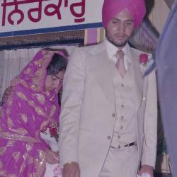 [Photo of Ajmer S. Sidhu and an unidentified woman on the Gurdwara steps]