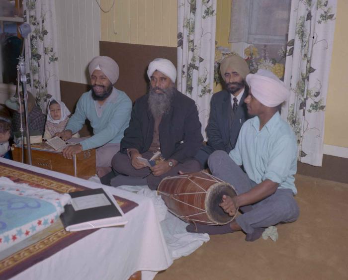 [Photo of four unidentified men in the Gurdwara]