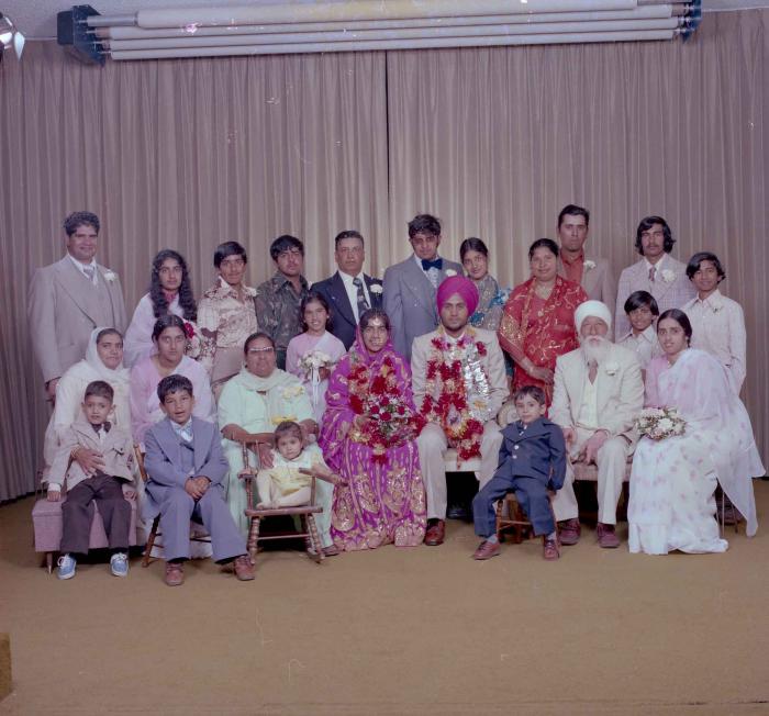 [Group portrait of Balbir Dhami, Inderjit Neger and wedding guests]