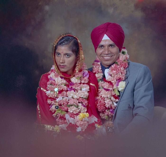[Group portrait of Daljit Dhaliwal and an unidentified bride]