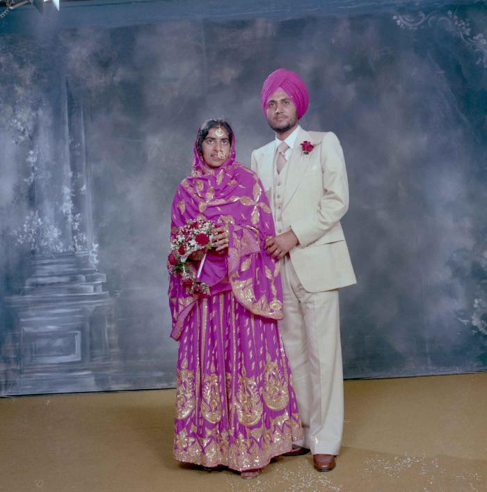 [Group portrait of Balbir Dhami and Inderjit Neger]