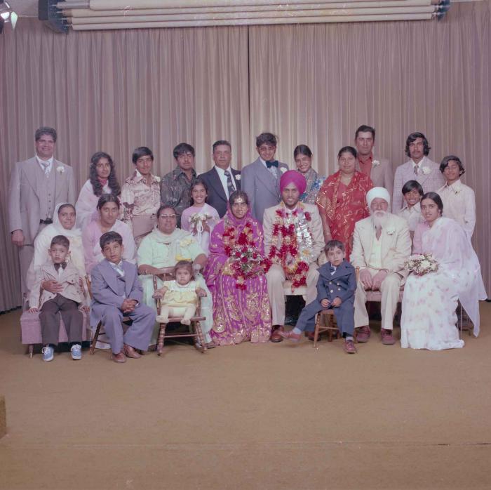 [Group portrait of Balbir Dhami, Inderjit Neger and wedding guests]