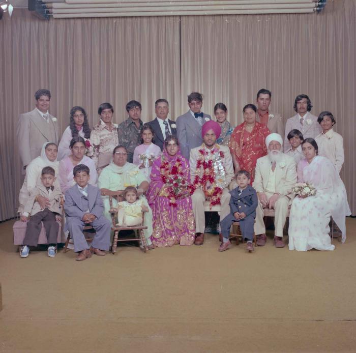 [Group portrait of Balbir Dhami, Inderjit Neger and wedding guests]