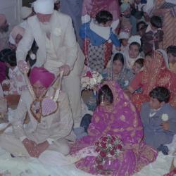 [Photo of Ajmer S. Sidhu and an unidentified woman on the Gurdwara steps]