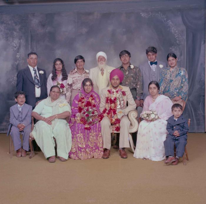 [Group portrait of Balbir Dhami, Inderjit Neger and wedding guests]