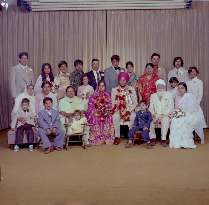 [Group portrait of Balbir Dhami, Inderjit Neger and wedding guests]